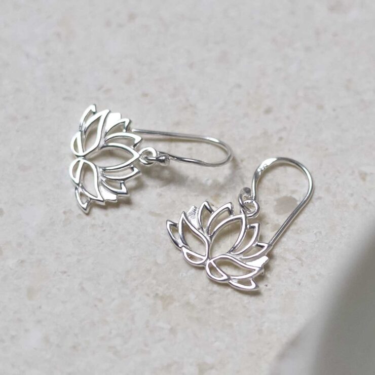 Sterling Silver Dangly Lotus Flower Earrings on jewellery tray