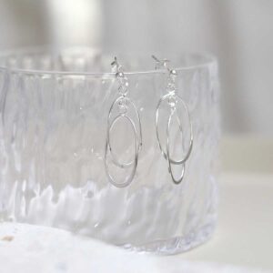 Sterling Silver Double Oval Stud Earrings on glass