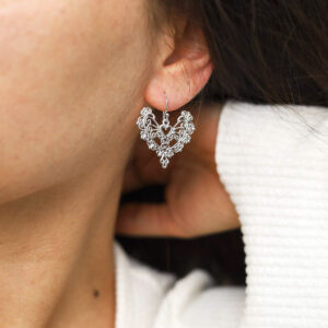 Sterling Silver Dangly Lace Heart Earrings on model