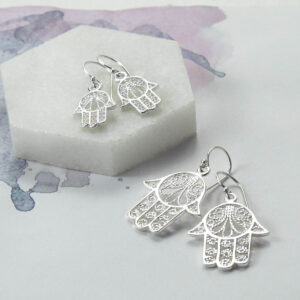 Small and Large Fatima Hand earrings on Marble