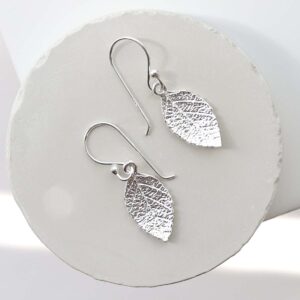 Sterling Silver Mint Leaf Dangly Earrings on jewellery dish