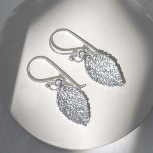 Sterling Silver Mint Leaf Dangly Earrings on jewellery dish