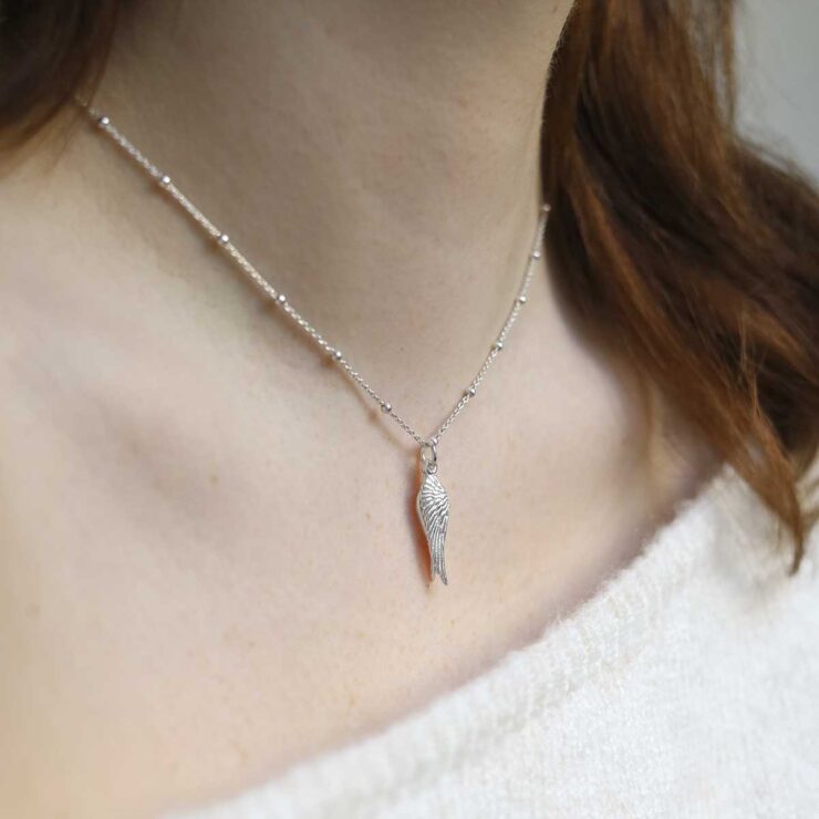 Sterling Silver Angel Wings Necklace on model