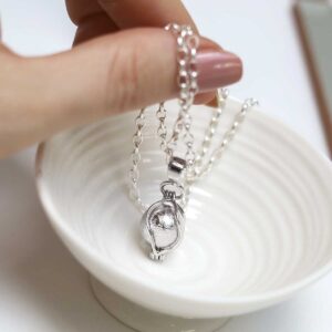 Model holding Muonionsalusta Meteorite Spinning Orb Necklace