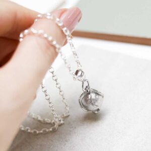 Model holding Muonionsalusta Meteorite Spinning Orb Necklace