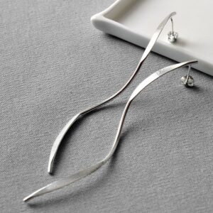 Sterling Silver Elongated Ribbon Stud Earrings on grey backdrop