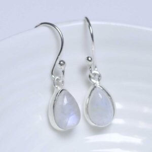 Sterling Silver Dangly Moonstone teardrop Earrings on white dish