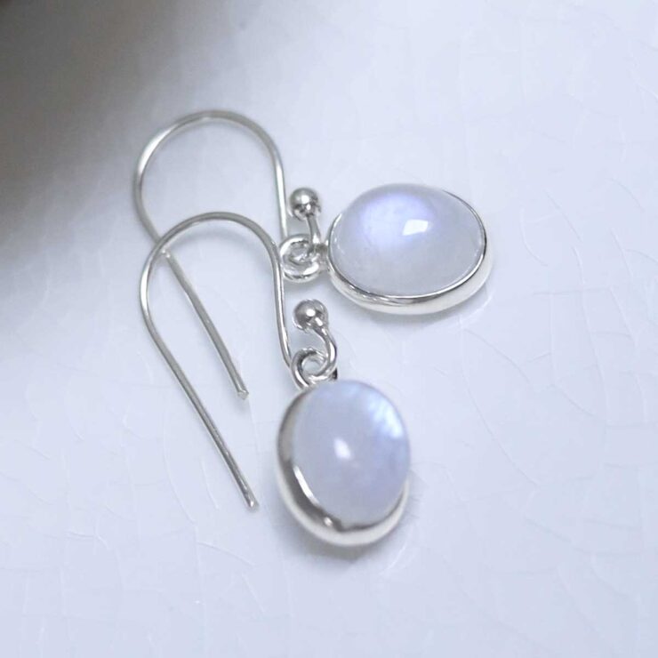 MJ750D_Sterling Silver Dangly Moonstone Oval Earrings_2 Sterling Silver Dangly Moonstone Oval Earrings on white