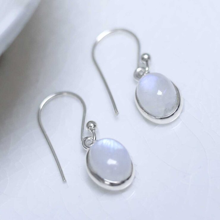 Sterling Silver Dangly Moonstone Oval Earrings on white