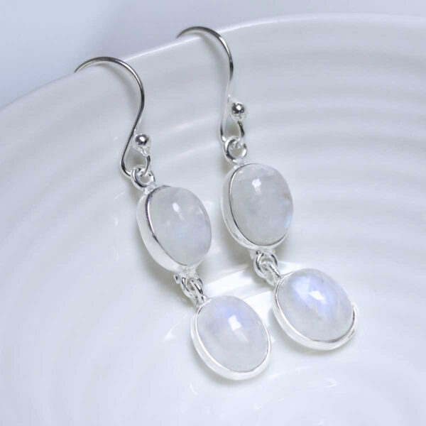 Sterling Silver Double Moonstone Dangly Oval Earrings on white dish
