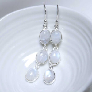 Sterling Silver Triple Moonstone Dangly Oval Earrings on white dish