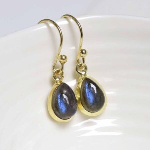 Sterling Silver Gold Plated Dangly Labradorite Teardrop Earring on white dish