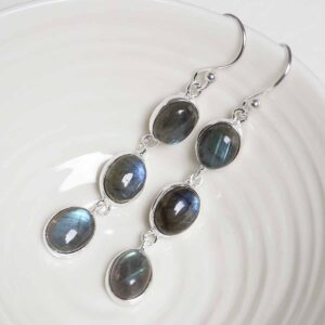 Sterling Silver Triple Labradorite Dangly Oval Earrings on white dish