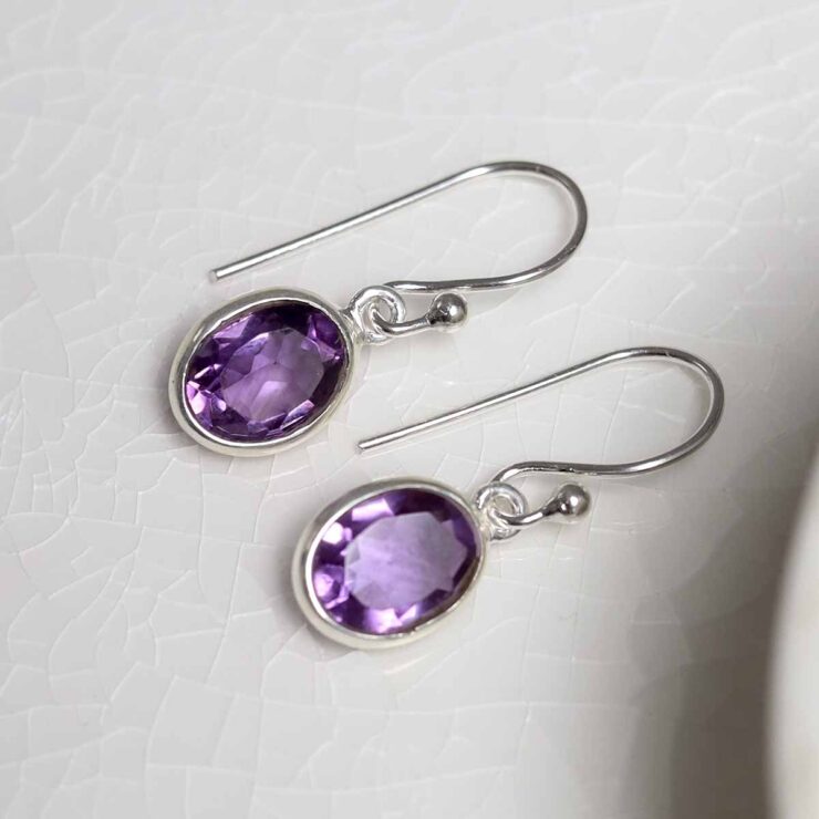 Sterling Silver Dangly Amethyst Oval Earrings on white
