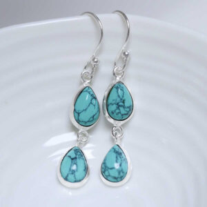 Sterling Silver Double Turquoise Dangly Teardrops on white dish
