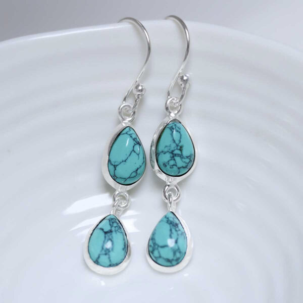 Sterling Silver Double Turquoise Dangly Teardrops on white dish