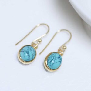 Sterling Silver Gold Plated Turquoise oval earrings on white