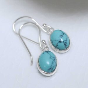 Sterling Silver Dangly Turquoise Oval Earrings on white