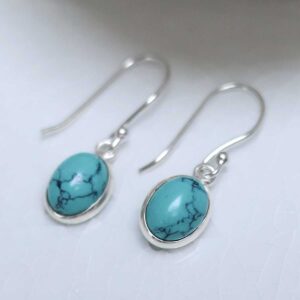 Sterling Silver Dangly Turquoise Oval Earrings on white