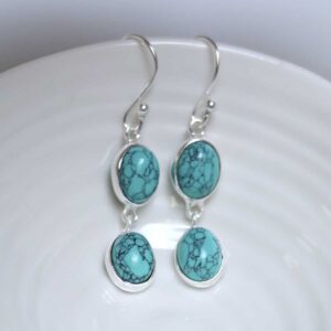 Sterling Silver Double Turquoise Dangly Oval Earrings on white dish