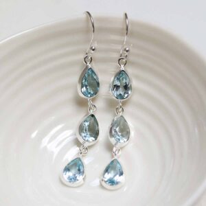 Sterling Silver Triple Blue Topaz Dangly Teardrops on white dish