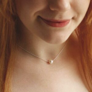 Single Pearl Necklace on Red haired model