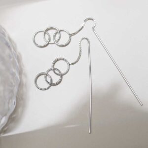 Sterling Silver Delicate Rings And Bar Threader Earrings on table