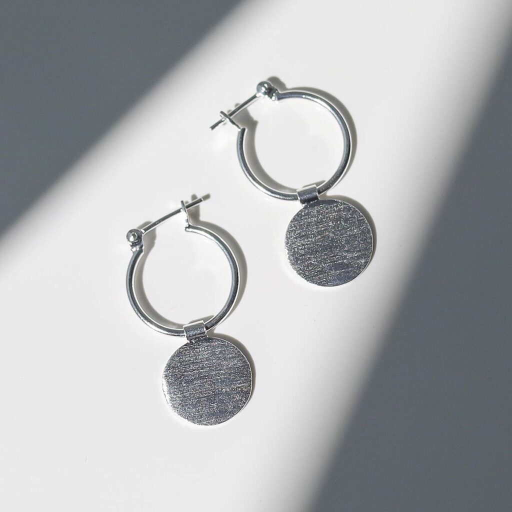 Sterling Silver Omega Drop Earrings in sunlight