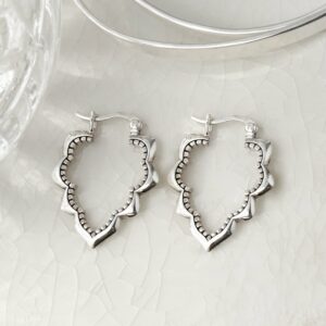 Sterling silver casablanca hoop earrings on white background