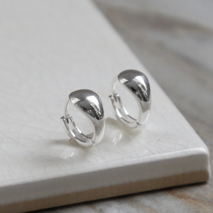 Sterling Silver Chunky Huggies on a white background,