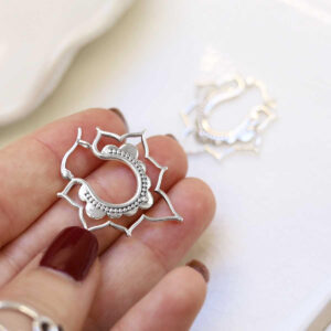 model holding Sterling Silver Kaleidoscope Hoops