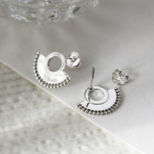 Sterling silver art deco sunburst stud earrings close up on great background showing front and back detail