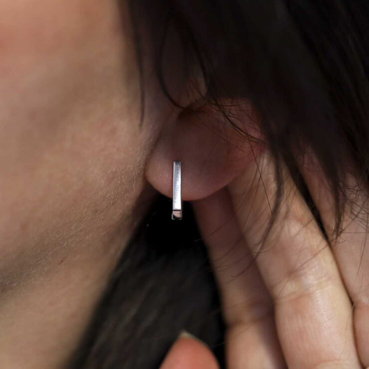 Sterling Silver Straight Edge Huggies on model