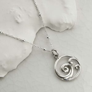 STERLING SILVER OCEAN WAVE NECKLACE on a white background