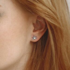 Pearl lotus studs on model with red hair