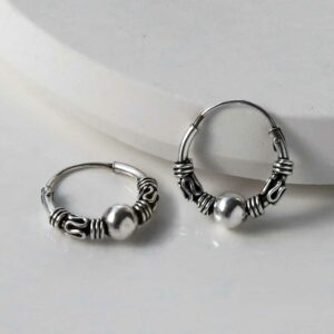 Silver Indo hoops on white background