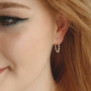 Silver Swinging bead studs on model with Red hair