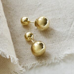 Gold Plated Venus Stud Earrings with a Cotton Background