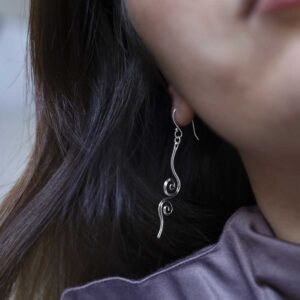 Sterling Silver Reflected Twirl Dangly Earrings on model