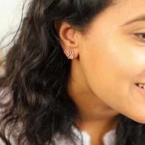 Brunette Model Wearing Rose Gold Plated Silver Paw Print Studs