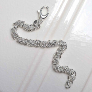 Sterling Silver Soft Circles Bracelet on ceramic background