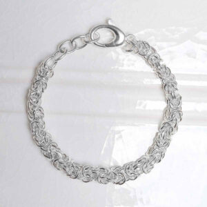Sterling Silver Soft Circles Bracelet on ceramic background