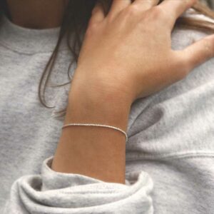 Margarita Bracelet on model with grey jumper