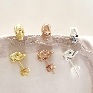 sterling silver mini skull studs showing gold silver rose gold