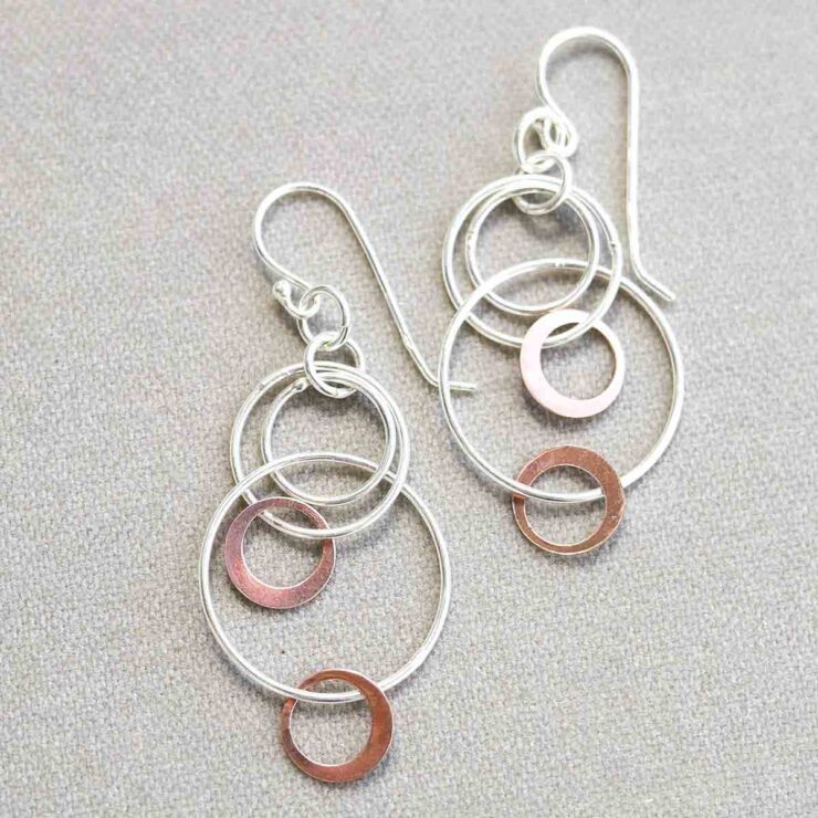 MZB63_Sterling Silver And Rose Gold Swinging Circles Dangly Earrings_7 Sterling Silver And Rose Gold Swinging Circles Dangly Earrings