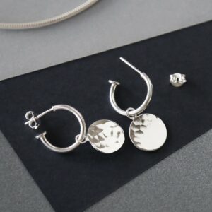 MZB94_Sterling Silver  Disc Stud Hoops on grey background catching light. showing butterfly off the hoop stud structure.