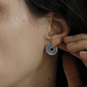 Oxidised sterling silver Marrakech studs on model with brunette hair.