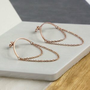 Rose Gold Half Circle Hoops with chain on multi coloured background tile