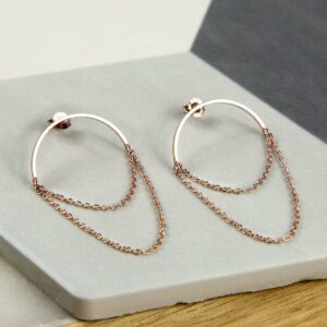 Rose Gold Half Circle Hoops with chain on multi coloured background tile