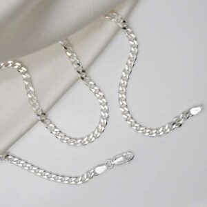 sterling silver heavy curb chain strewn on linen